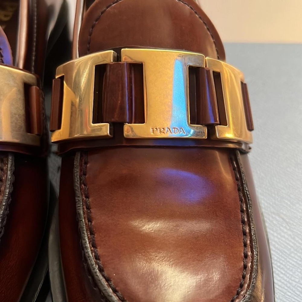 Prada tobacco loafers gold chain/buckle